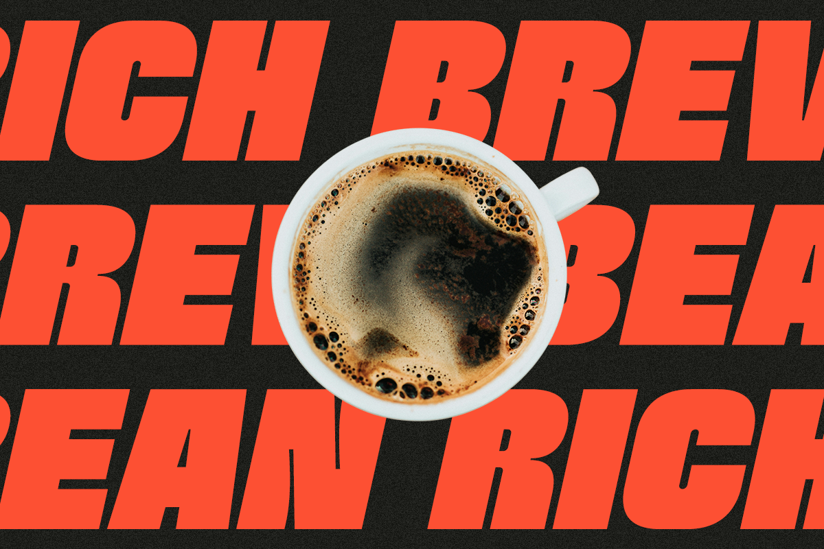 Overhead shot of black coffee in white mug centered on bold red text against dark background