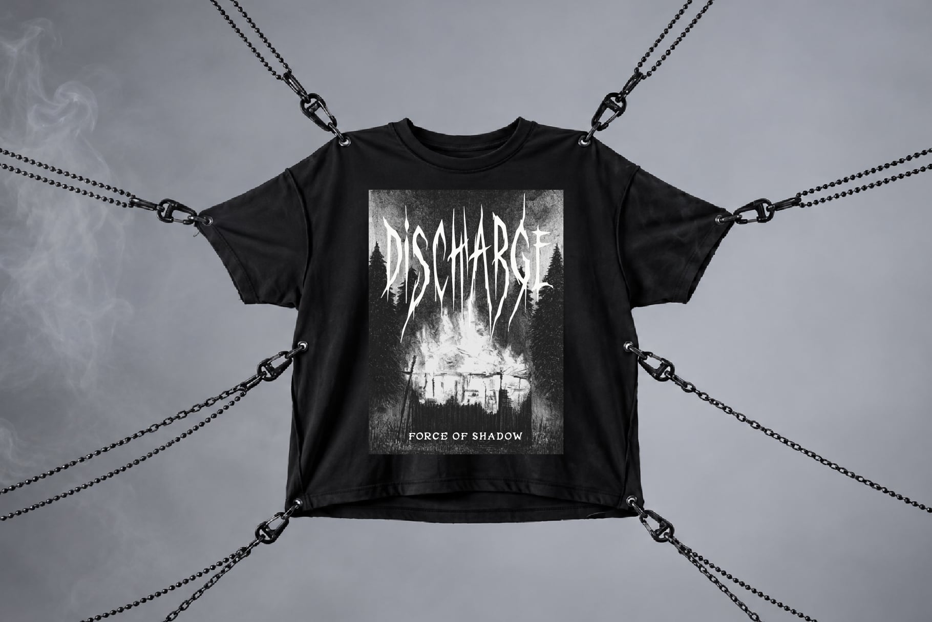 Black tee with metal chains, dark forest graphic, bold band logo design