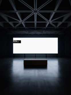 Minimalist gallery space with geometric ceiling, white billboard above black box pedestal