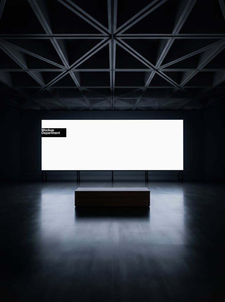 Minimalist gallery space with geometric ceiling, white billboard above black box pedestal