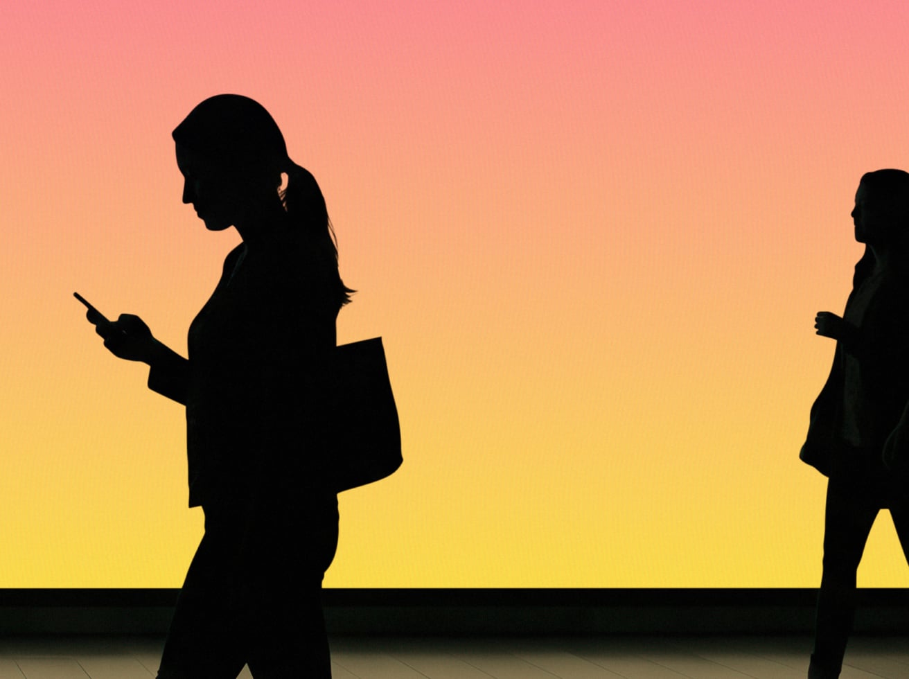 Silhouettes of two women in business casual holding phones against warm gradient sunset background