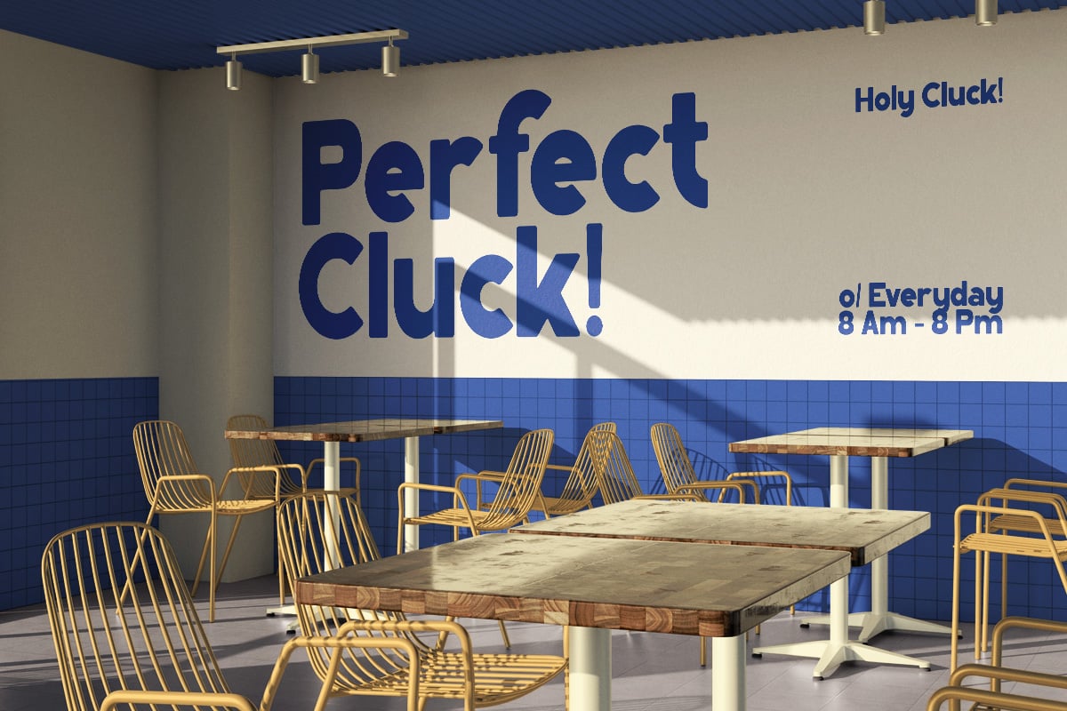 Modern cafe interior with gold chairs, wood tables, blue tile wall, brass track lighting
