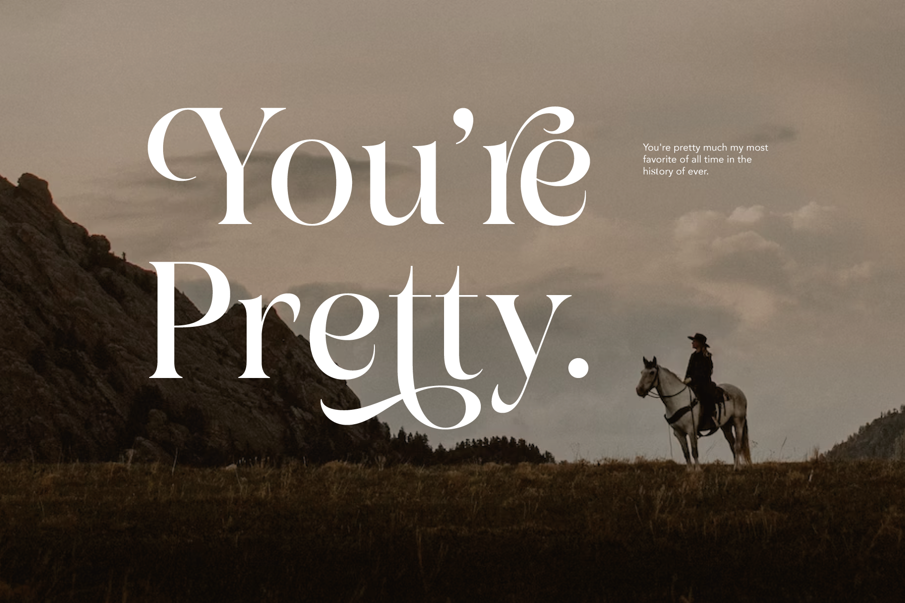 Elegant serif font overlay on moody landscape with cowboy on horseback, romantic western vibe