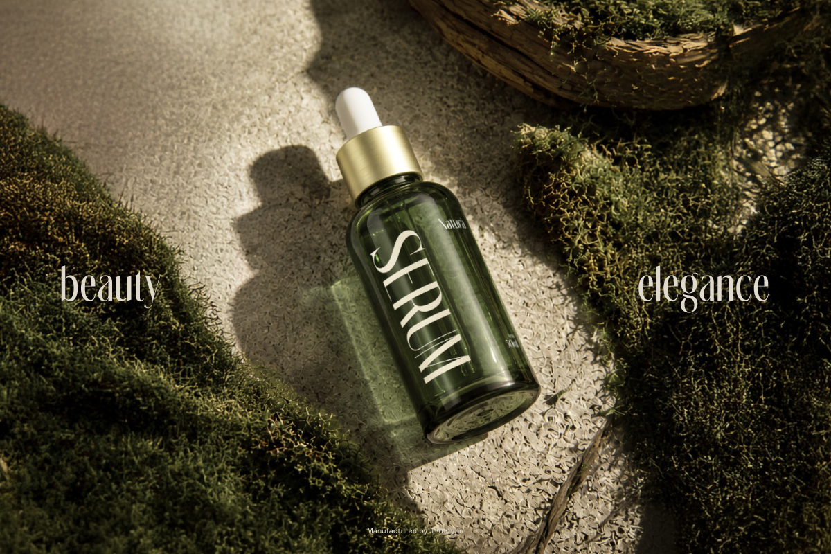 Skincare serum bottle with gold dropper on concrete surrounded by moss, text overlay reads beauty elegance