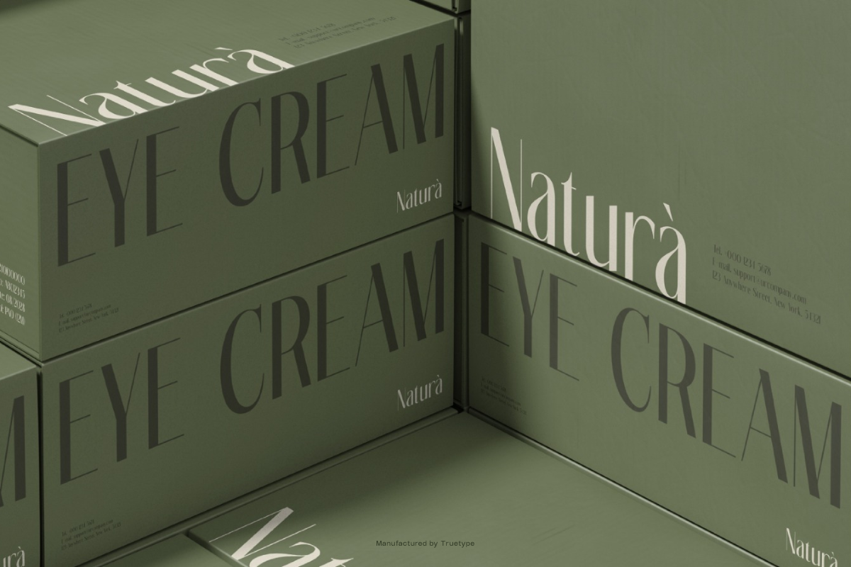Stacked cosmetic boxes in sage green with elegant serif typography for eye cream product packaging mockup