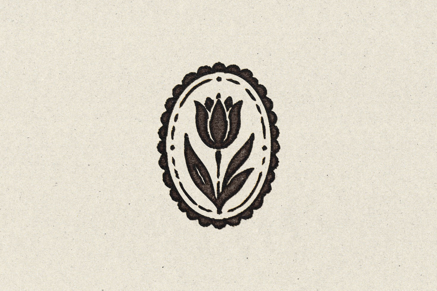 Vintage tulip stamp design with scalloped border on cream textured background