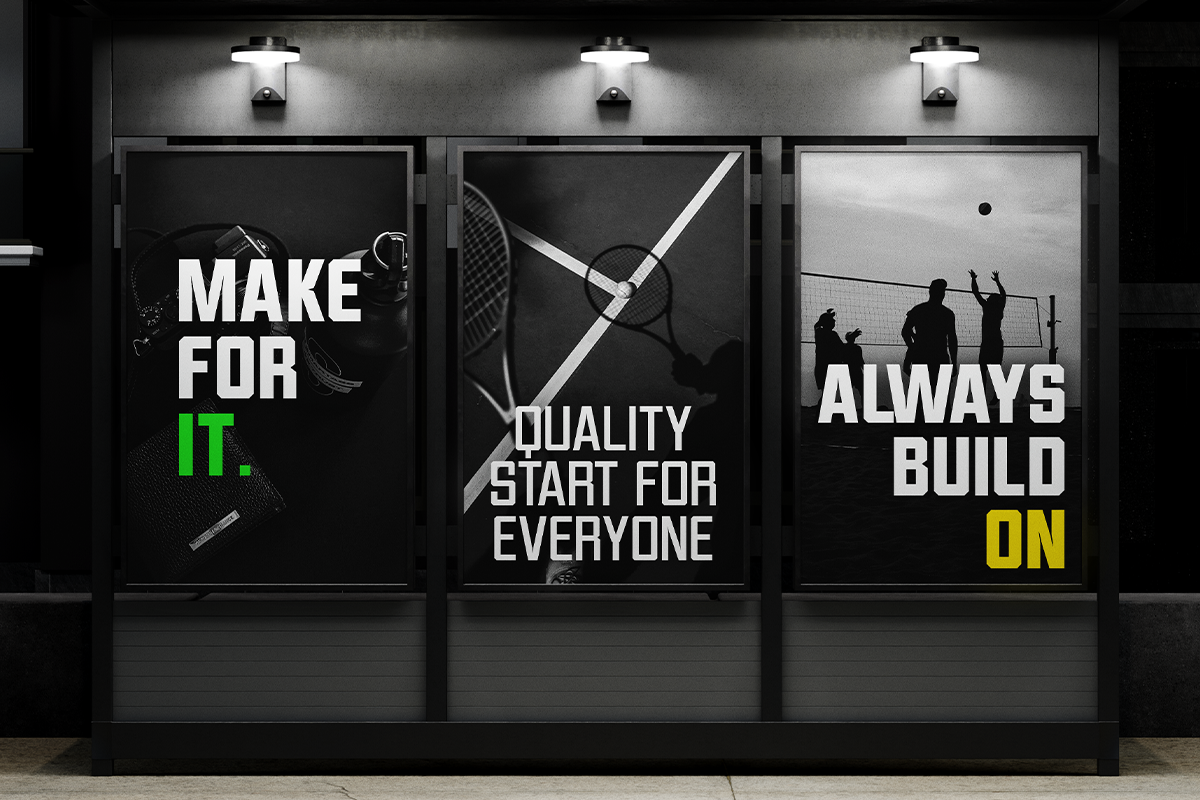 Three backlit storefront posters with bold typography about sports, quality, plus teamwork in black white with neon accent colors