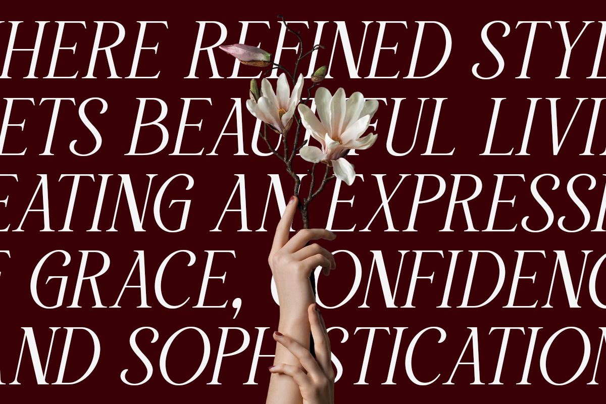 Hand holding delicate white flower against burgundy background with elegant serif typography overlay