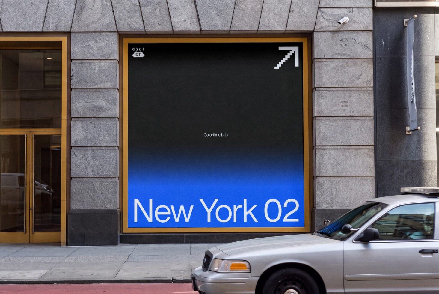 Storefront window display mockup with blue gradient background, "New York 02" text, gold frame on concrete building facade