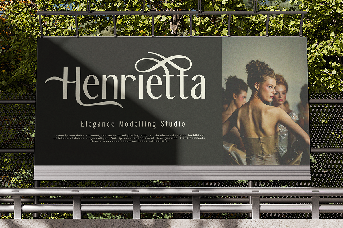 Henrietta elegance modeling studio billboard mockup with classy serif branding on dark background